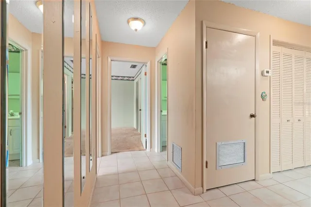 a kitchen with a stove a sink and a refrigerator