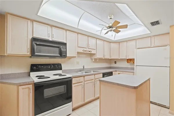 a kitchen with a stove a refrigerator and a refrigerator