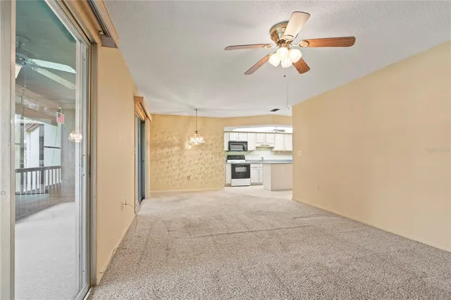 a view of a kitchen with a sink and a stove top oven