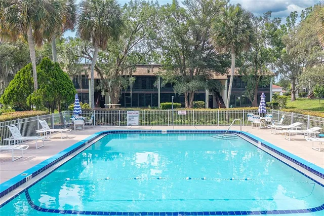 a view of a swimming pool with a patio