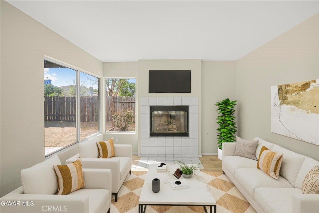 44910 12th Street East Lancaster, CA 93535 - Photo 14 of 47 a living room with furniture and a large window