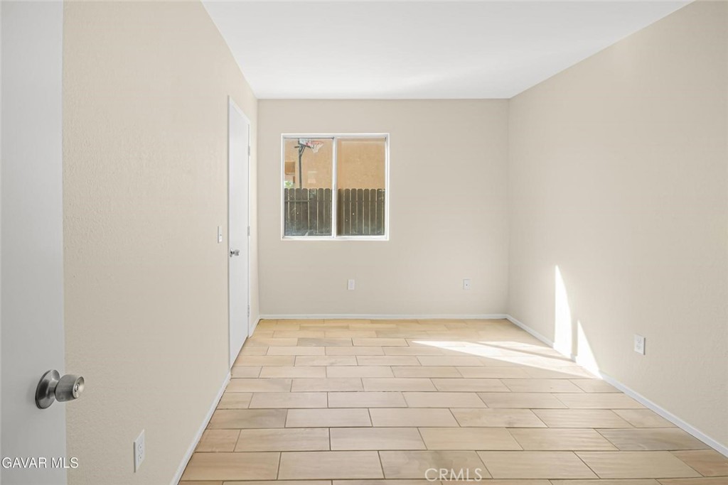 44910 12th Street East Lancaster, CA 93535 - Photo 17 of 47 a view of an empty room with windows