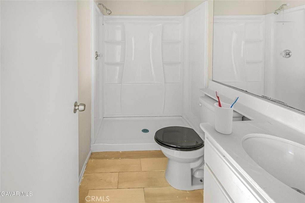 44910 12th Street East Lancaster, CA 93535 - Photo 20 of 47 a bathroom with a sink and a toilet