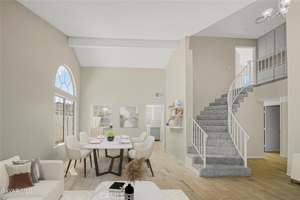 44910 12th Street East Lancaster, CA 93535 - Photo 2 of 47 a view of a livingroom with furniture and staircase