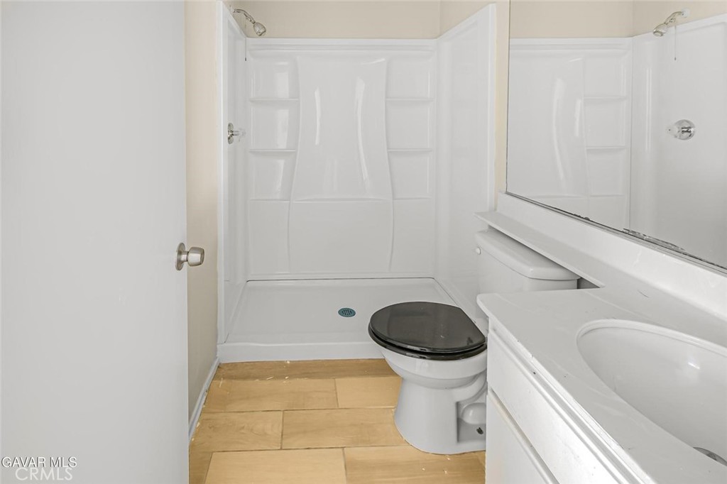 44910 12th Street East Lancaster, CA 93535 - Photo 21 of 47 a bathroom with a sink and a toilet