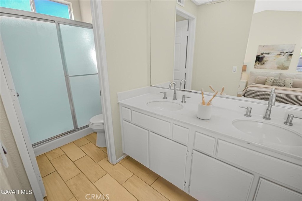 44910 12th Street East Lancaster, CA 93535 - Photo 30 of 47 a bathroom with a sink and a mirror