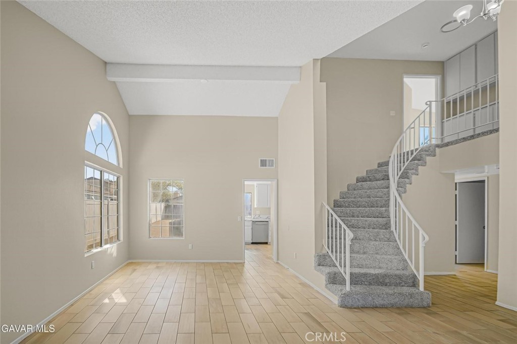 44910 12th Street East Lancaster, CA 93535 - Photo 3 of 47 a view of entryway with wooden floor and stairs
