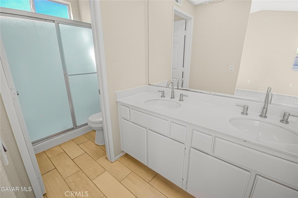 44910 12th Street East Lancaster, CA 93535 - Photo 31 of 47 a bathroom with a sink and a mirror