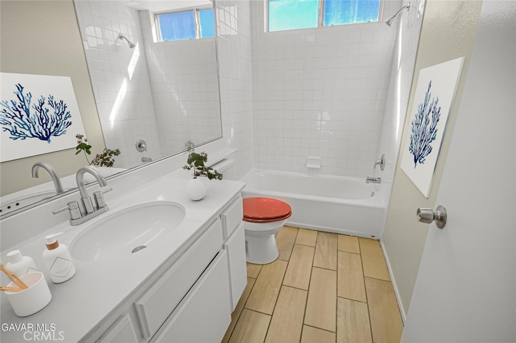 44910 12th Street East Lancaster, CA 93535 - Photo 32 of 47 a bathroom with a sink a toilet and shower