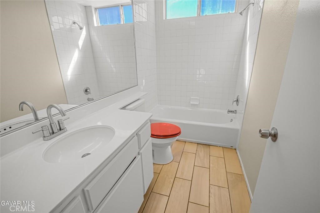 44910 12th Street East Lancaster, CA 93535 - Photo 33 of 47 a bathroom with a sink toilet vanity and bathtub