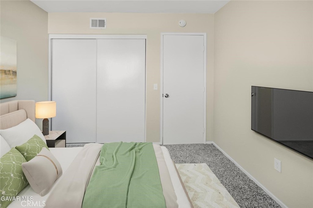 44910 12th Street East Lancaster, CA 93535 - Photo 40 of 47 a bedroom with a bed and a flat screen tv