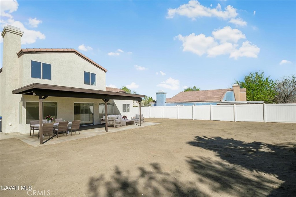 44910 12th Street East Lancaster, CA 93535 - Photo 44 of 47 a view of a house with sitting area and roof