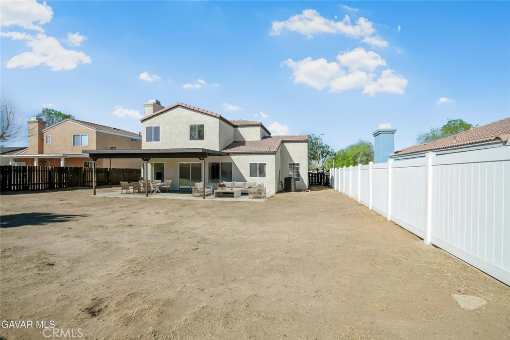 44910 12th Street East Lancaster, CA 93535 - Photo 46 of 47 a front view of a house with a yard
