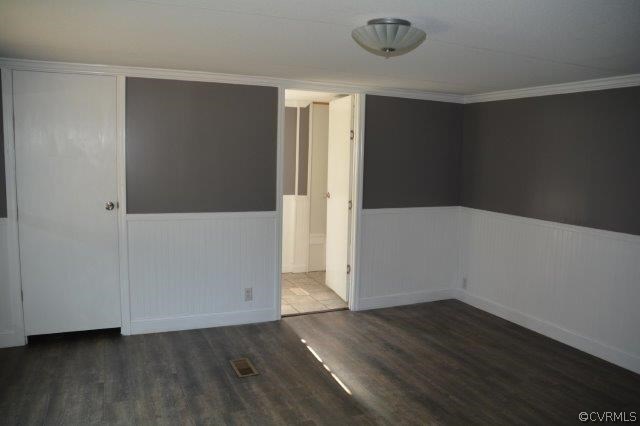 140 Sheppards Road Farmville, VA 23901 - Photo 13 of 22 an empty room with wooden floor and windows