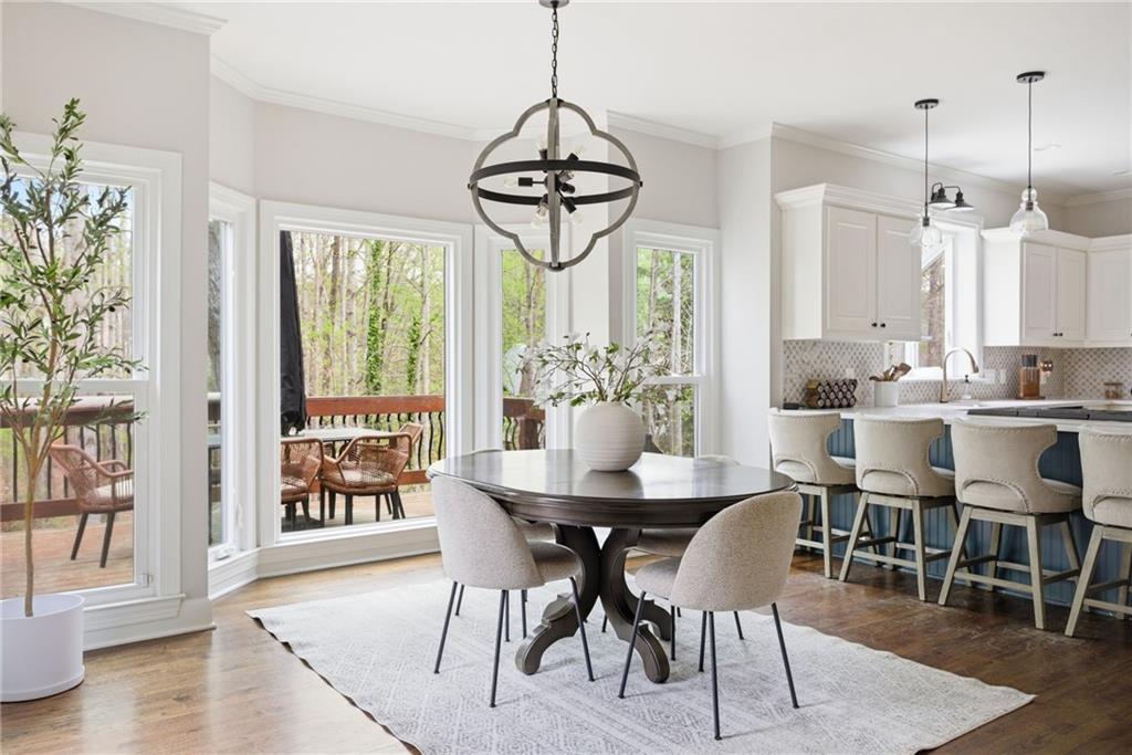 5335 Cottage Farm Road Johns Creek, GA 30022 - Photo 11 of 60 a dining room with furniture window wooden floor