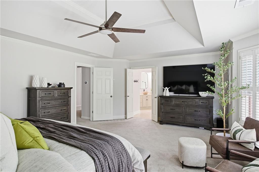 5335 Cottage Farm Road Johns Creek, GA 30022 - Photo 21 of 60 a bedroom with furniture and a flat screen tv