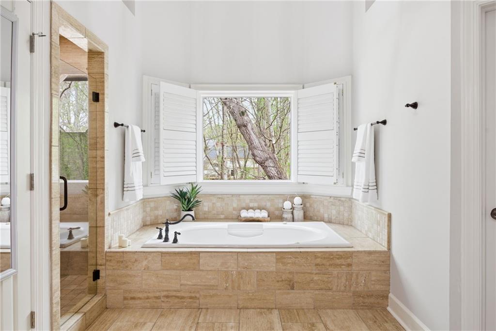 5335 Cottage Farm Road Johns Creek, GA 30022 - Photo 24 of 60 a spacious bathroom with a tub shower and window