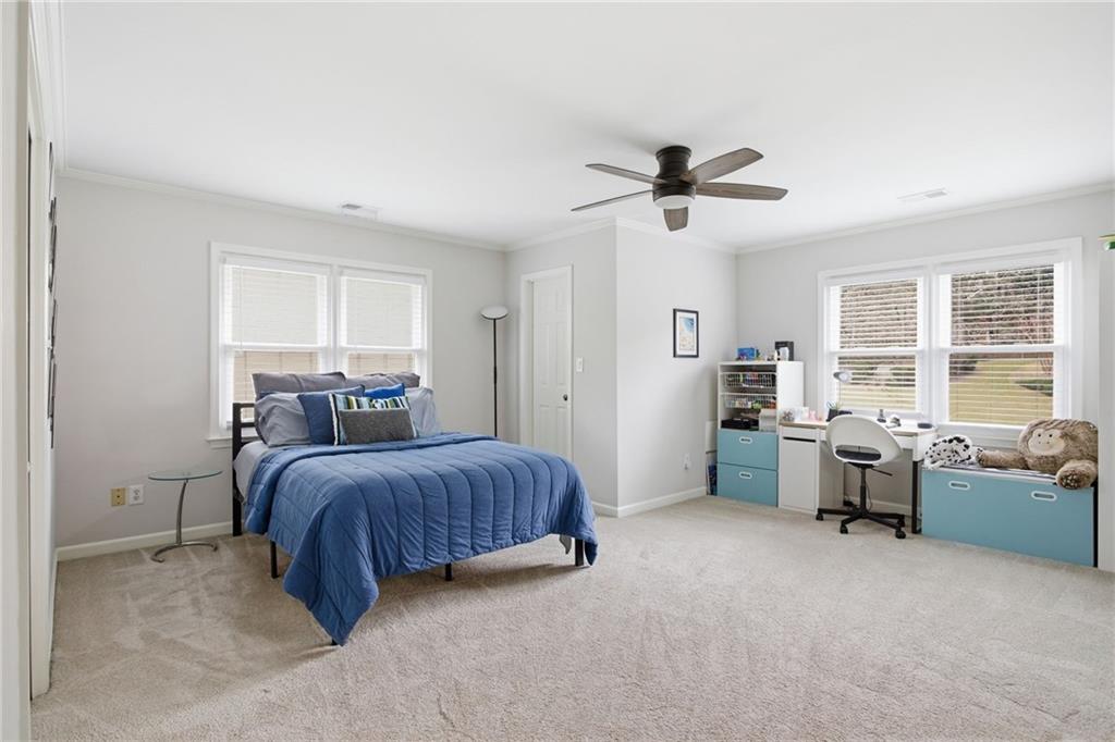 5335 Cottage Farm Road Johns Creek, GA 30022 - Photo 27 of 60 a bed room with a bed and furniture