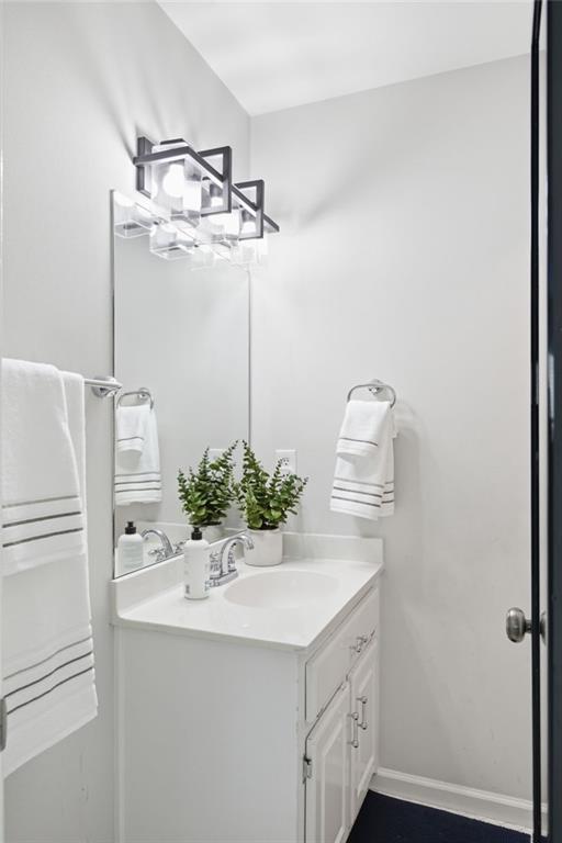 5335 Cottage Farm Road Johns Creek, GA 30022 - Photo 28 of 60 a bathroom with a sink and mirror