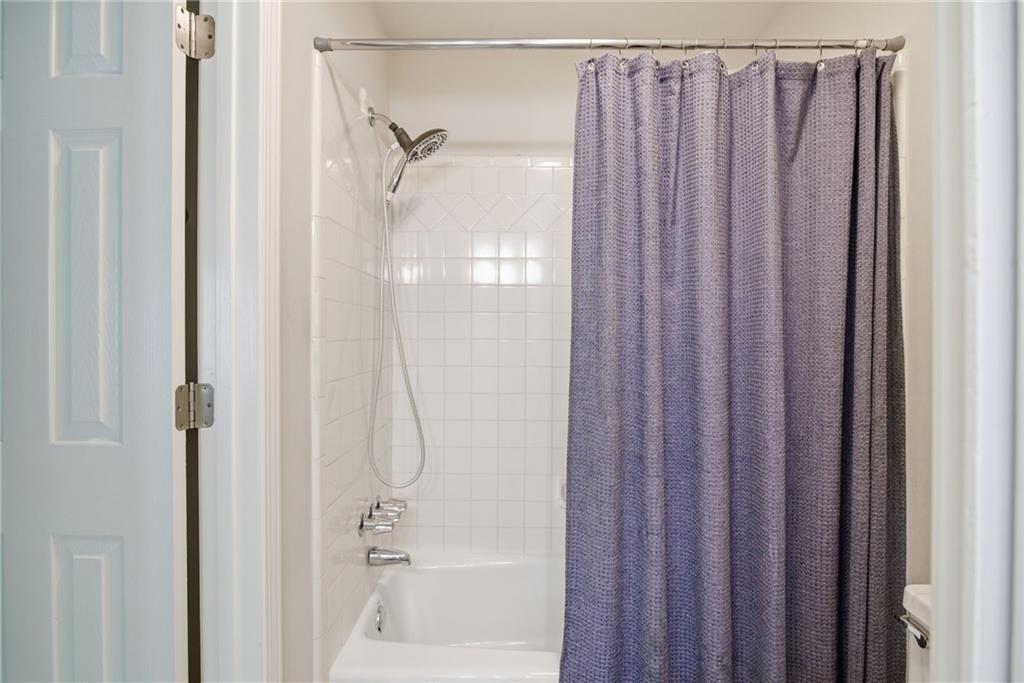 5335 Cottage Farm Road Johns Creek, GA 30022 - Photo 29 of 60 a bathroom with a shower and a bath tub