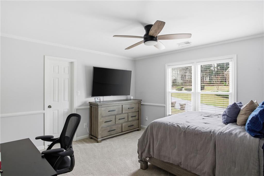 5335 Cottage Farm Road Johns Creek, GA 30022 - Photo 30 of 60 a bedroom with a bed tv and furniture