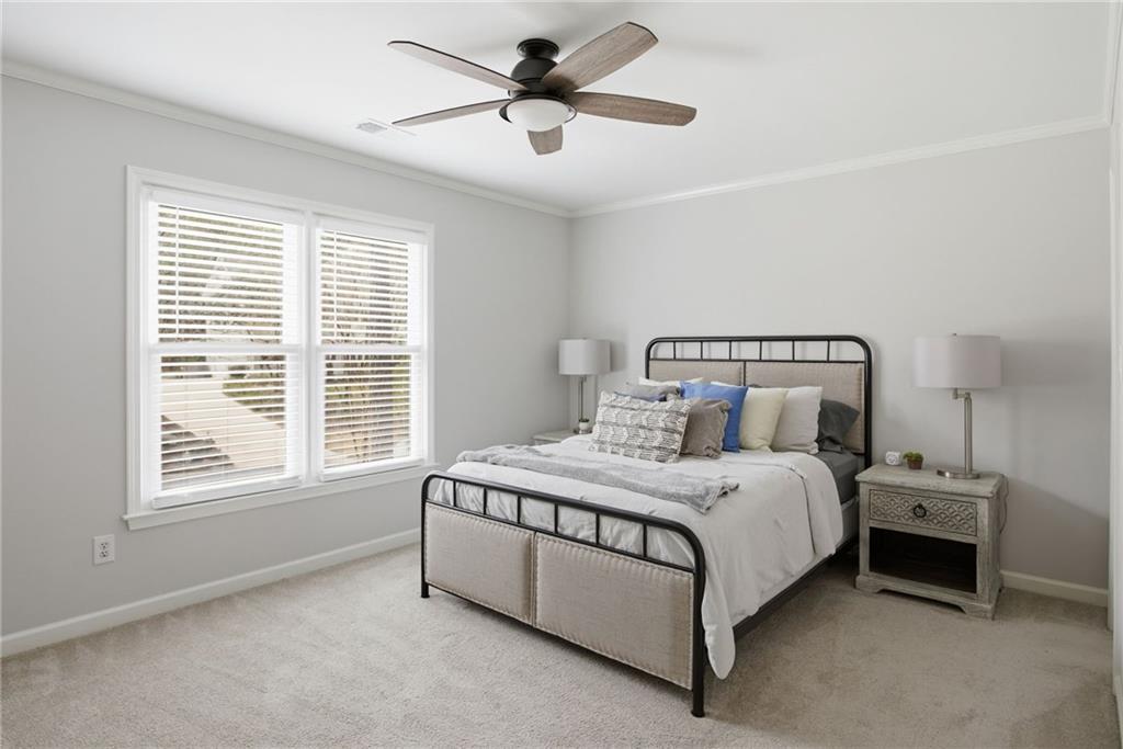 5335 Cottage Farm Road Johns Creek, GA 30022 - Photo 31 of 60 a bedroom with a bed and a ceiling fan in it