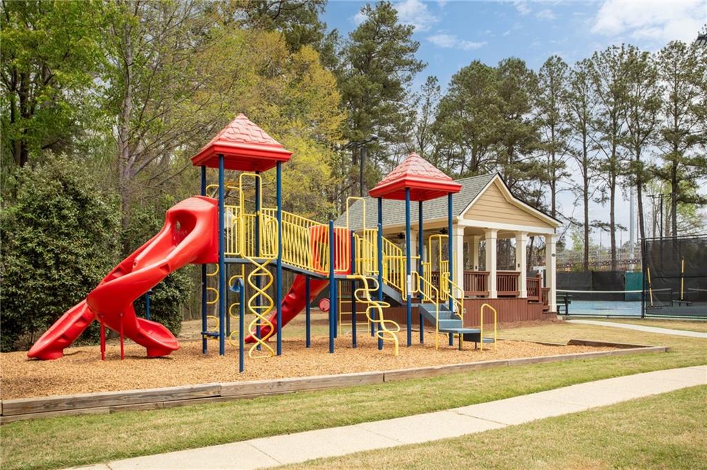 5335 Cottage Farm Road Johns Creek, GA 30022 - Photo 56 of 60 a view of a park with slide and bench