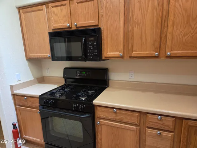 a kitchen with a stove and a microwave