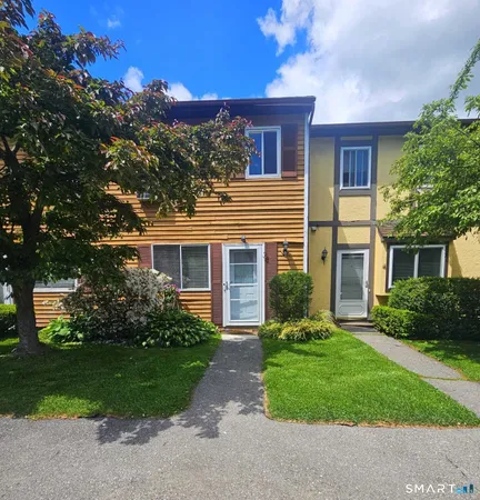 front view of a house with a yard