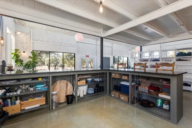 a kitchen with counter top space sink and stove