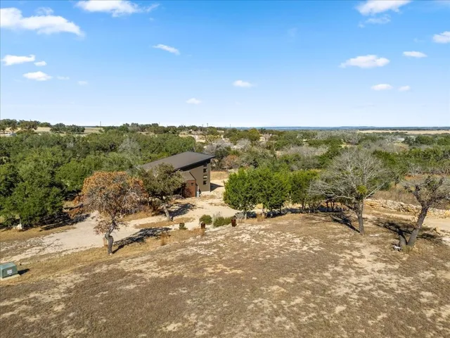 a view of a terrace with a forest