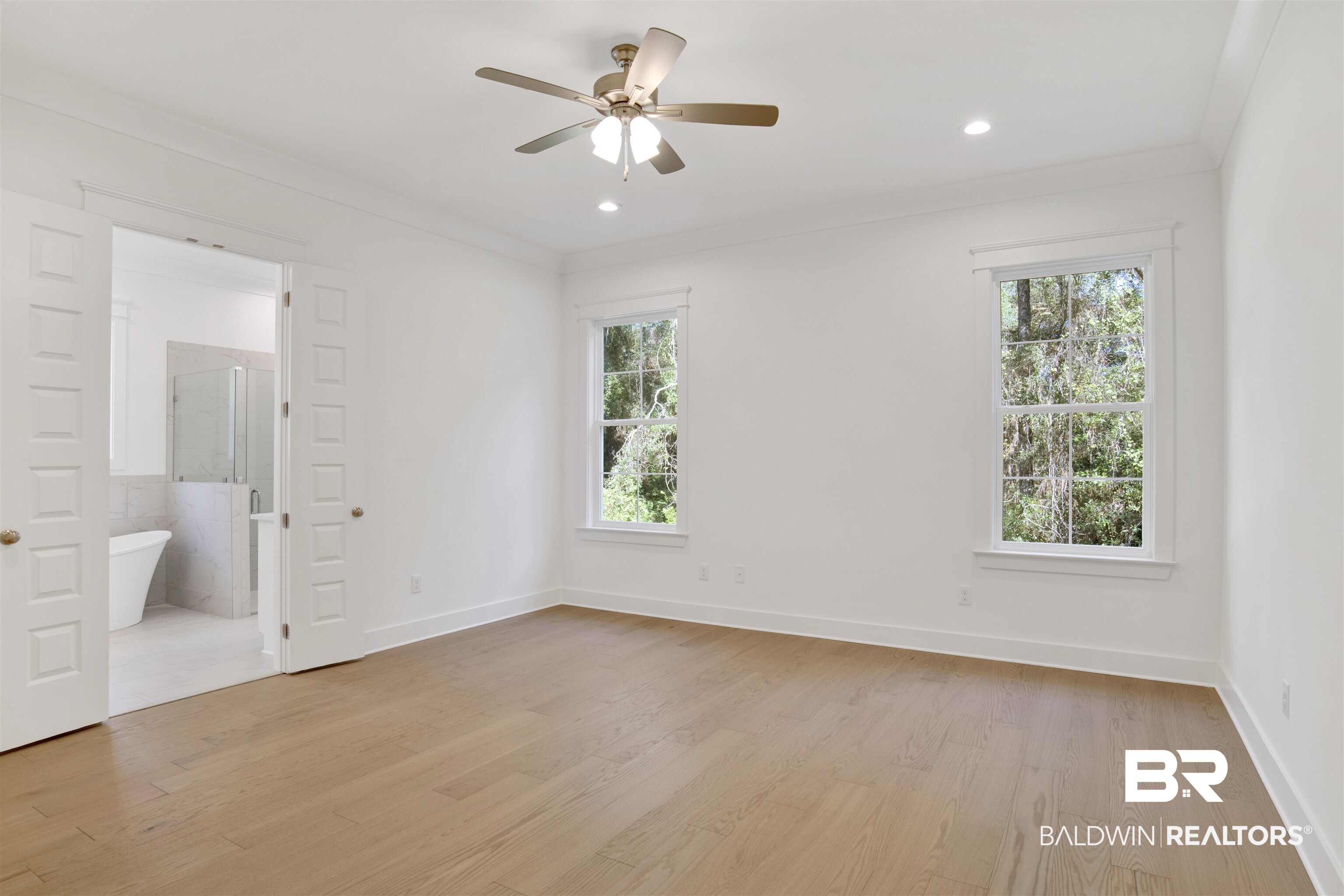 5 Long Leaf Circle Fairhope, AL 36532 - Photo 21 of 44 Unfurnished room with ornamental molding, light hardwood / wood-style floors, ceiling fan, and a healthy amount of sunlight