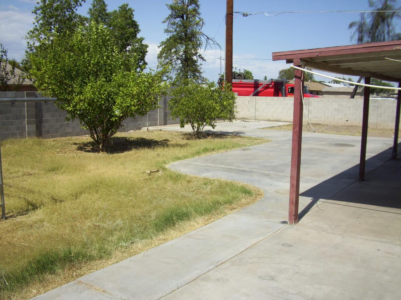 5902 West Granada Road Phoenix, AZ 85035 - Photo 5 of 5 a view of swimming pool with a yard