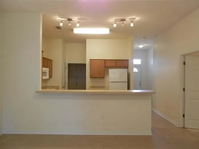a bathroom with double sink and a mirror