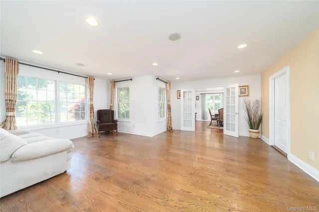 a view of a livingroom with furniture hardwood floor and a living room