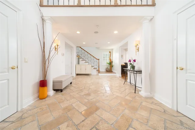 a view of a hallway with seating area