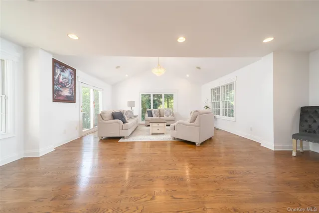 a living room with fireplace furniture and a flat screen tv