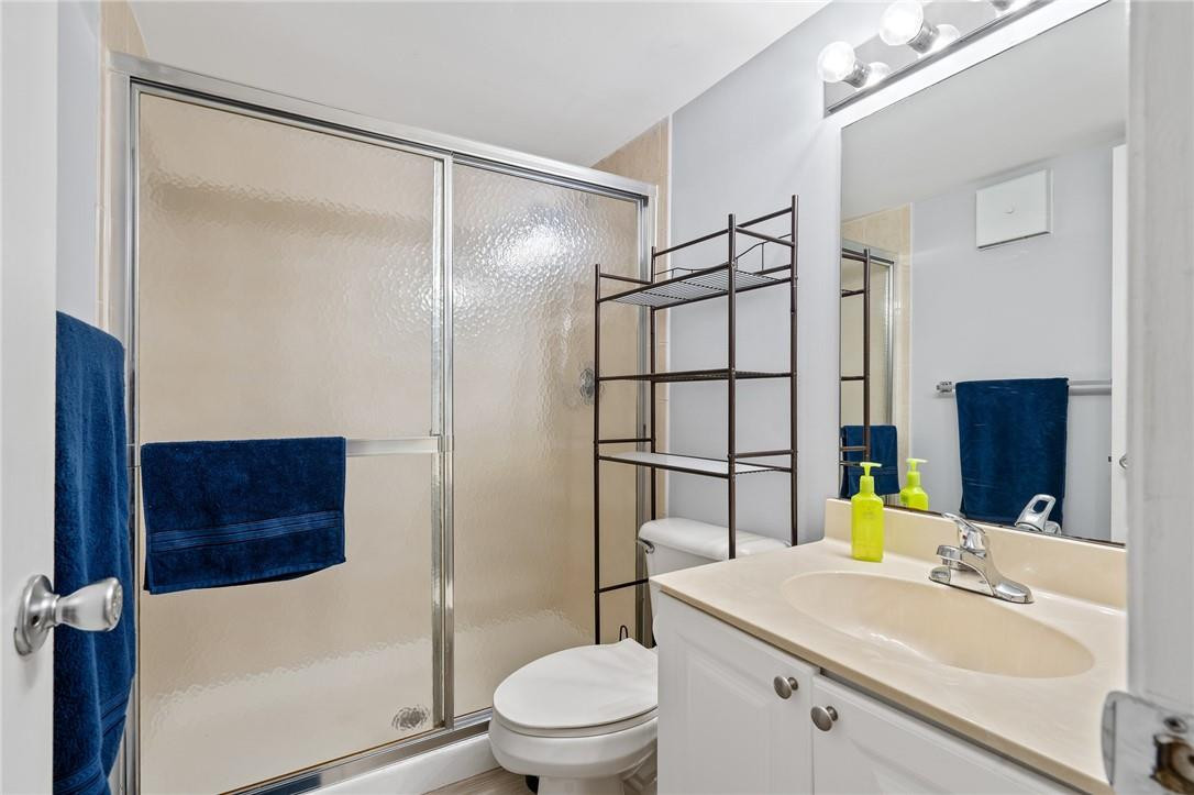 721 North Pine Island Road, Unit 302 Plantation, FL 33324 - Photo 12 of 25 a bathroom with a sink toilet vanity and shower