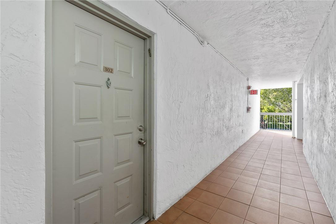 721 North Pine Island Road, Unit 302 Plantation, FL 33324 - Photo 17 of 25 a view of an entryway with white walls