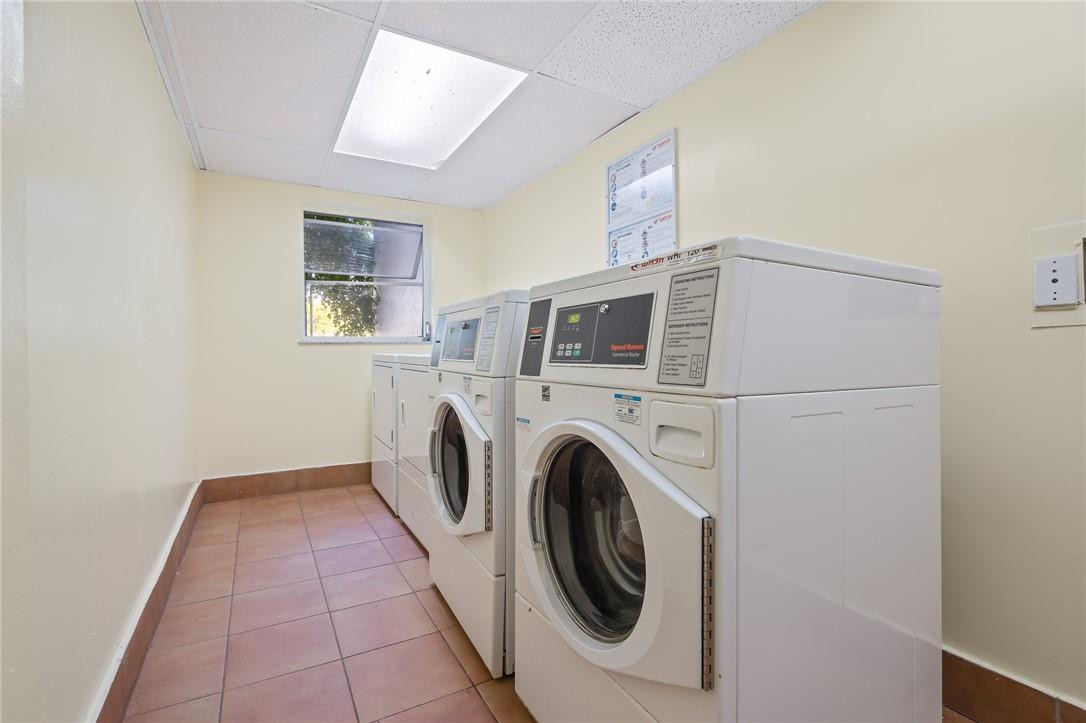 721 North Pine Island Road, Unit 302 Plantation, FL 33324 - Photo 24 of 25 a utility room with dryer and washer