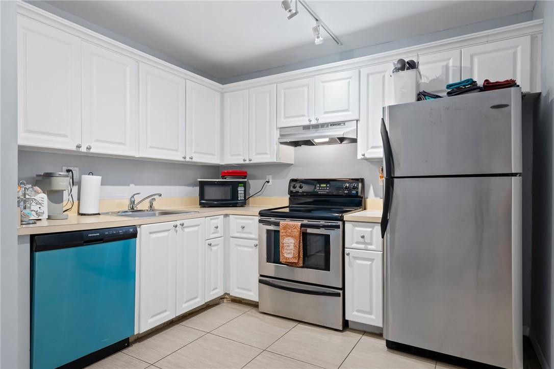 721 North Pine Island Road, Unit 302 Plantation, FL 33324 - Photo 5 of 25 a white refrigerator freezer sitting in a kitchen