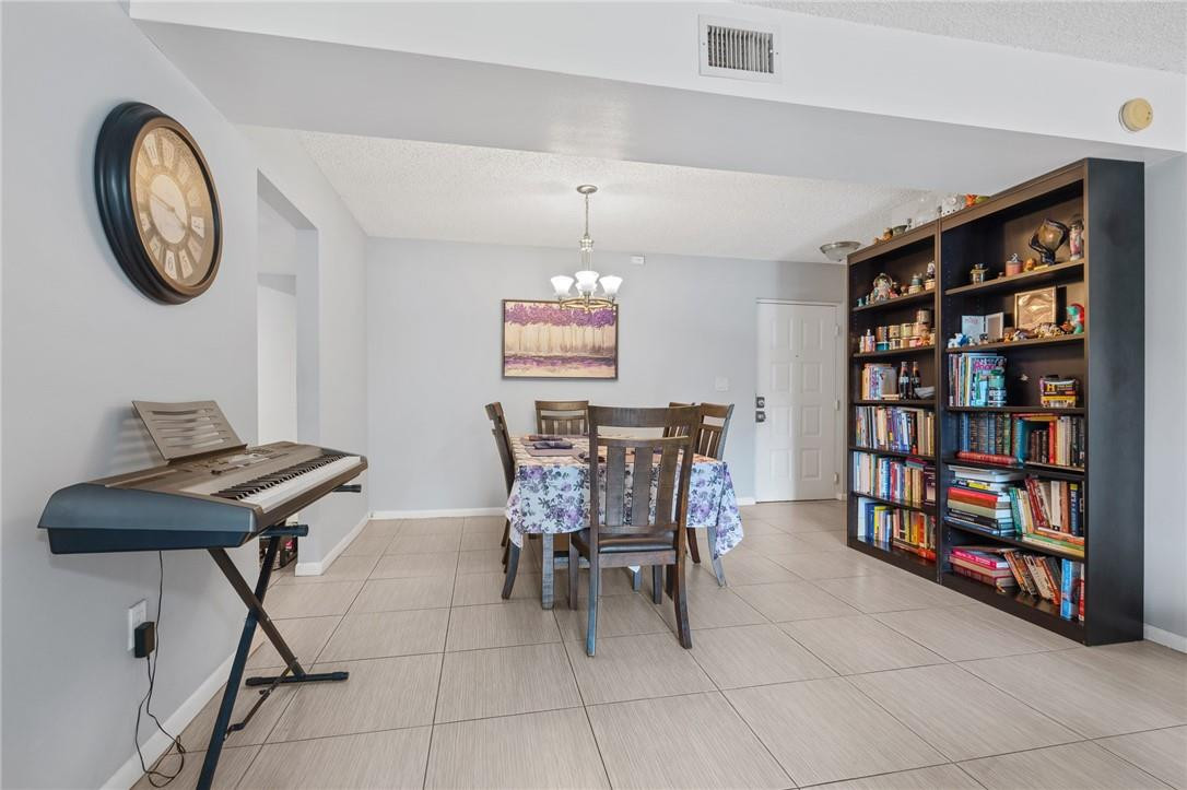721 North Pine Island Road, Unit 302 Plantation, FL 33324 - Photo 8 of 25 a dining room with furniture and a window