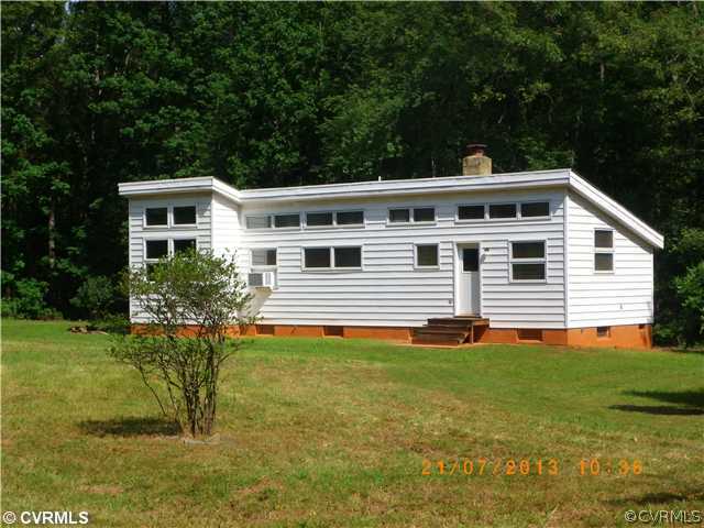 1025 Pothole Road Manakin-Sabot, VA 23103 - Photo 1 of 8 a front view of a house with a yard