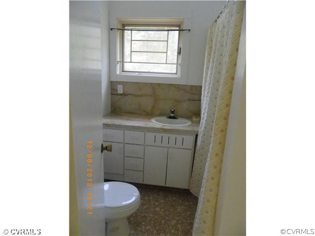 1025 Pothole Road Manakin-Sabot, VA 23103 - Photo 6 of 8 a bathroom with a sink and a toilet