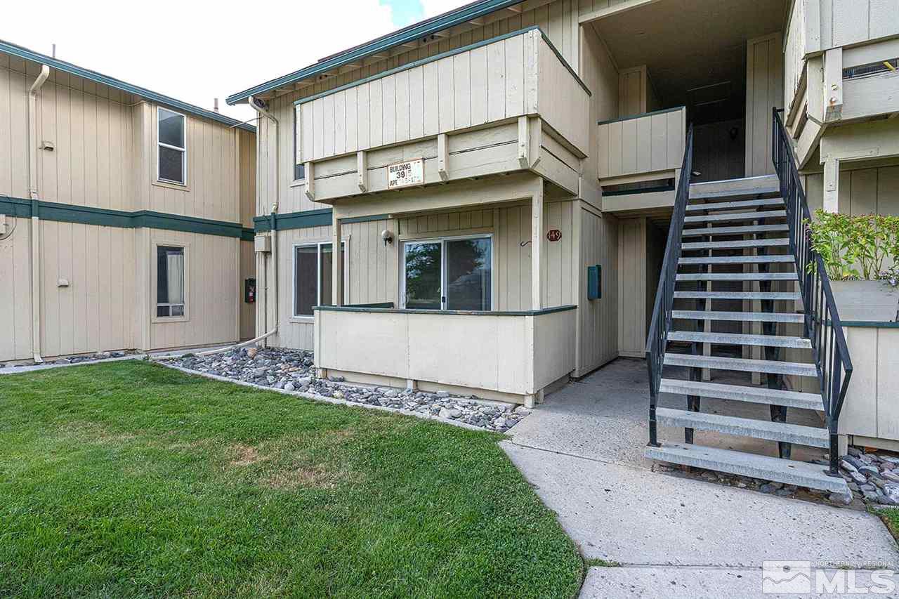 3915 Clear Acre Lane, Unit 149 Reno, NV 89512 - Photo 18 of 21 a view of a house with a yard