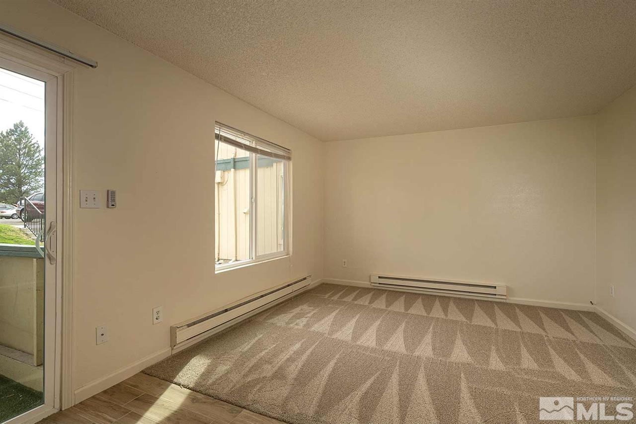 3915 Clear Acre Lane, Unit 149 Reno, NV 89512 - Photo 4 of 21 a view of an empty room and window