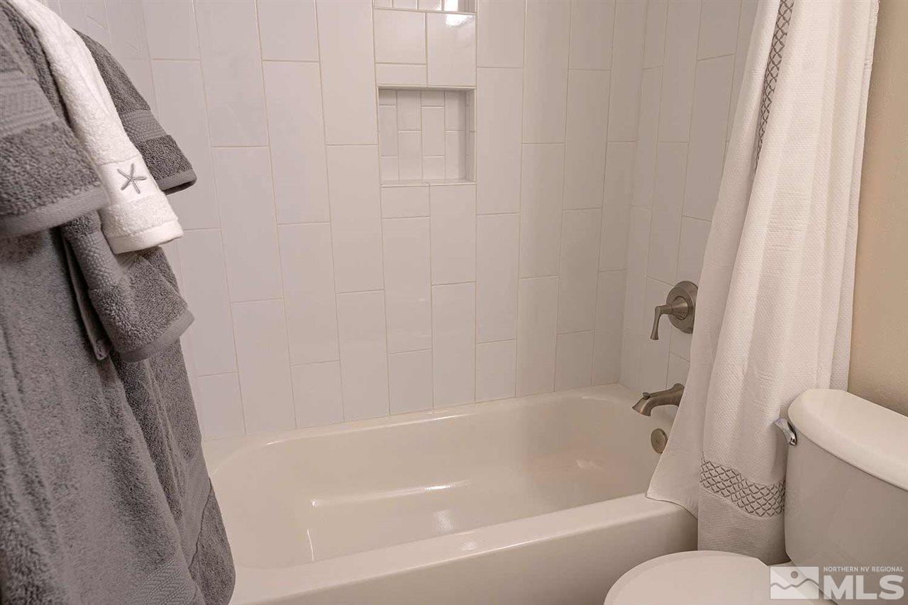 3915 Clear Acre Lane, Unit 149 Reno, NV 89512 - Photo 9 of 21 a bathroom with a bathtub