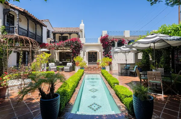a front view of house with yard and outdoor seating