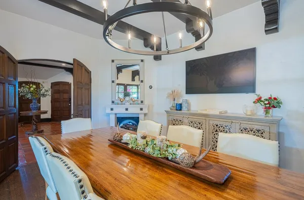 a bathroom with a granite countertop toilet a sink a mirror and a shower