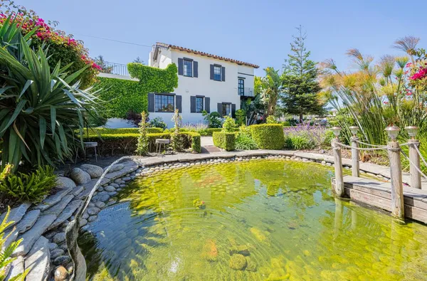 a view of a dining room with furniture and chandelier kitchen